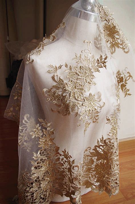 bwige gold metallic accents lace fabric|White.